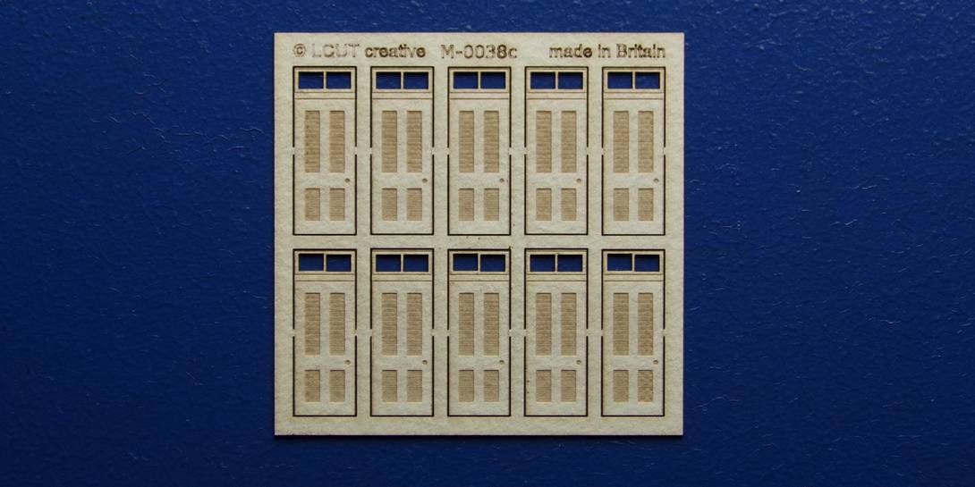 M 00-38c OO gauge kit of 10 single doors with square transom type 1 Kit of 10 single doors with square transom type 1.
